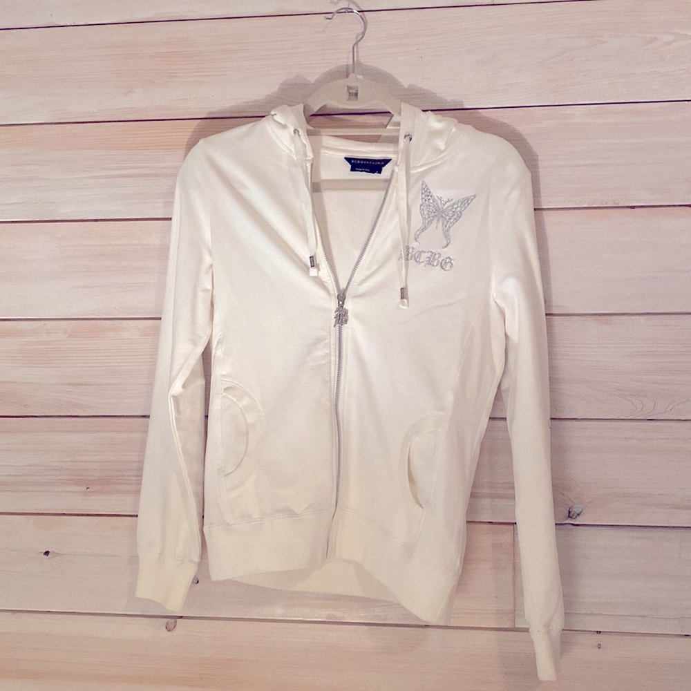 White BCBG MAXAZRIA Zip Up Jacket with Silver Beaded Butterfly Detailing.